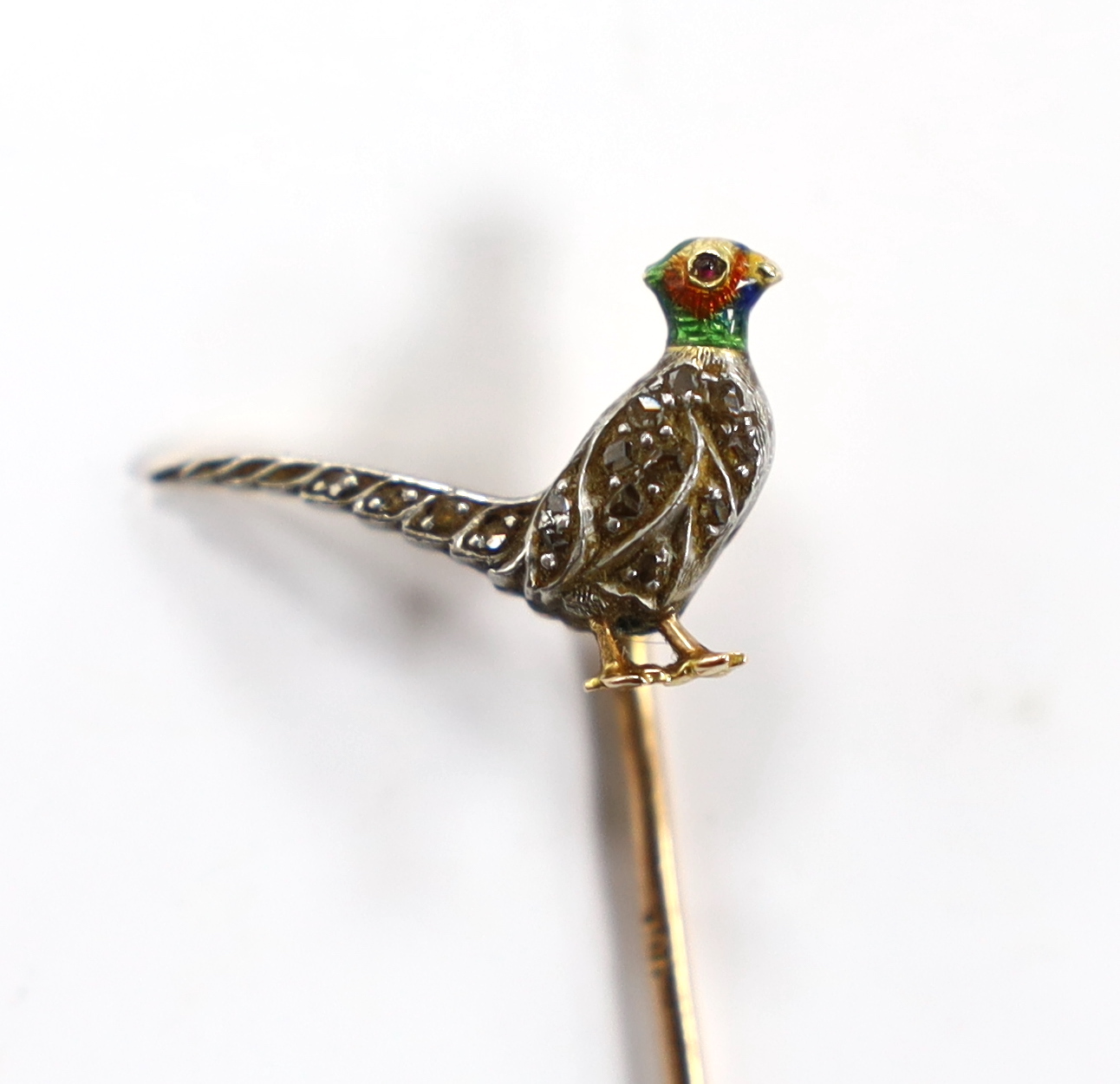 An Edwardian yellow metal, enamel and rose cut diamond set pheasant stick pin, 68mm, gross weight 2.1 grams.